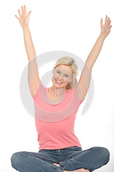 Attractive Happy Pleased Young Woman Sitting on the Floor Celebrating