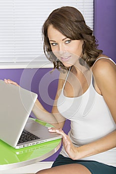 Attractive Happy Secretive Young Woman Using Laptop Computer