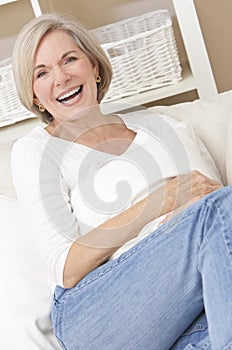 Attractive Happy Senior Woman Laughing at Home