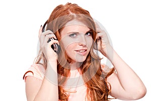 Attractive happy woman with headphones listen to music isolated