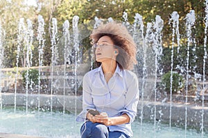 Attractive Happy Young African American Woman Listening Music Earphones