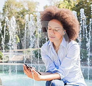 Attractive Happy Young African American Woman Listening Music Earphones