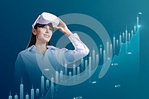 Attractive happy young businesswoman with vr glasses looking at abstract glowing business chart on blue background. Trade,