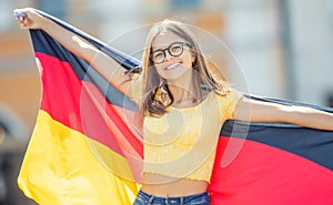 Attractive happy young girl with the germany flag