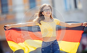 Attractive happy young girl with the germany flag