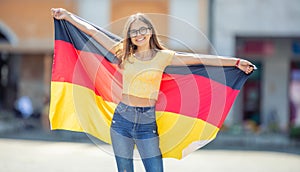 Attractive happy young girl with the germany flag