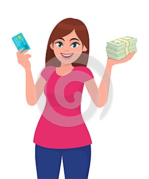 Attractive happy young woman holding or showing a credit/debit card, bundle of cash/money/currency notes in hand.