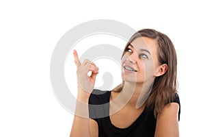 Attractive happy young woman pointing
