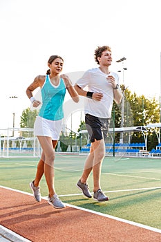 Attractive healthy fitness couple running