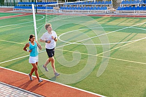 Attractive healthy fitness couple running