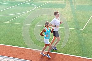 Attractive healthy fitness couple running