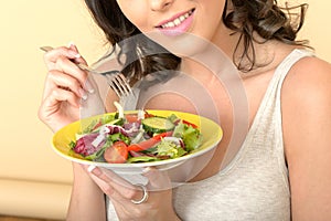 Attractive Healthy Happy Young Woman Holding a Fresh Mixed Salad