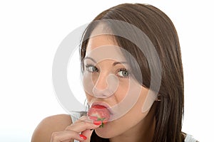 Attractive Healthy Young Woman Eating a Fresh Ripe Juicy Strawberry