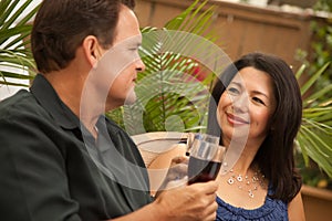 Attractive Hispanic and Caucasian Couple Drinking