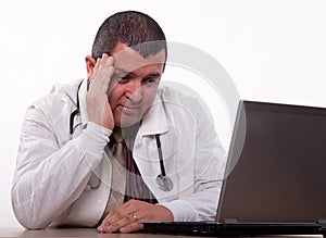 Attractive hispanic thirties male doctor headache