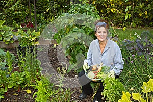 Attractive Home Gardener with vegetables