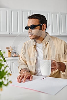 attractive indian man with visual impairment