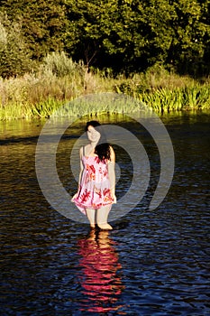 Smiling Japanese American Woman Standing In River