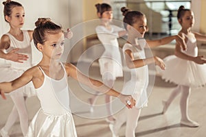 Attractive kids ballerinas in studio