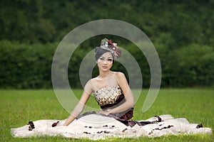 Attractive lady in formal gown at park