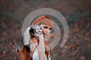 Attractive lady playfully and temptingly looks into camera, girl with fiery red hair and bangs holds cute tamed ferret