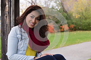 Attractive Latino woman outdoors during autumn