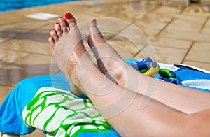 Attractive Legs, Feet and toes on a sunbed