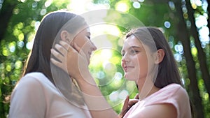 Attractive lesbian couple meeting secretly, love despite society condemnation
