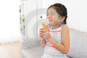 Attractive little girl children eating ice cream