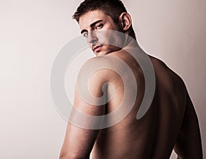 Attractive male model. Close-up smiling man's face.