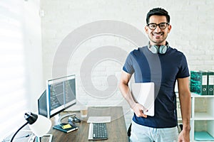 Attractive Male Programmer Working At Home