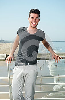 Attractive male smiling at the beach