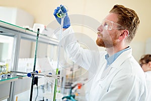 Attractive student of chemistry working in lab
