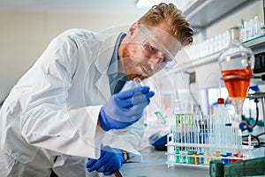 Attractive student of chemistry working in lab