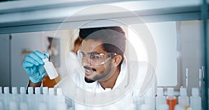 Attractive student of chemistry working in lab