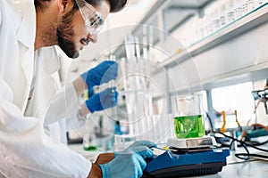 Attractive student of chemistry working in lab