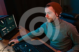 Male Video Editor Working on His Personal Computer with Big Display photo