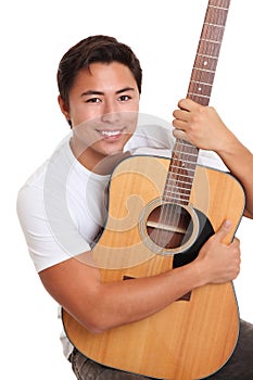 Attractive man with an acoustic guitar