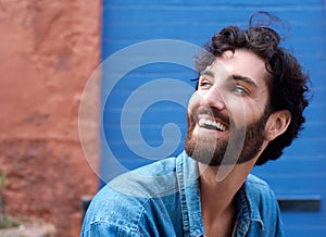 Attractive man with beard laughing