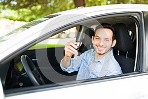 Attractive man feeling happy to buy a new car