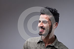 Attractive man in green shirt, smiling