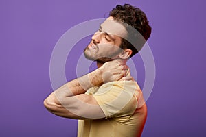 Attractive man has pain in neck.how do you relieve spasms in neck