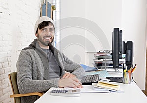 Attractive man in hipster beanie businessman working happy at office with computer