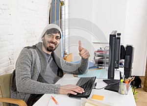 Attractive man in hipster beanie businessman working happy at office with computer