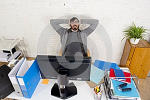 Attractive man hipster trendy style businessman working home office with desktop computer