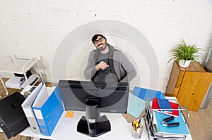 Attractive man hipster trendy style businessman working home office with desktop computer