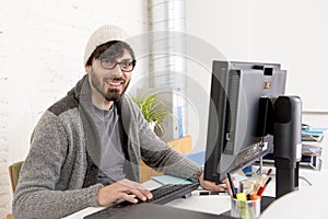 Attractive man hipster trendy style businessman working home office with desktop computer