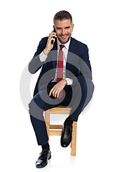 Attractive man in his forties having a conversation on the phone