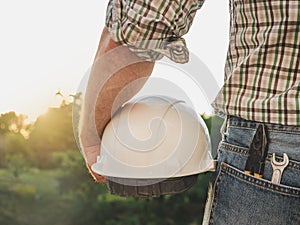 Attractive man holding tools in his hands