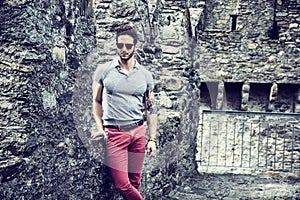 Attractive man outdoor in old European castle